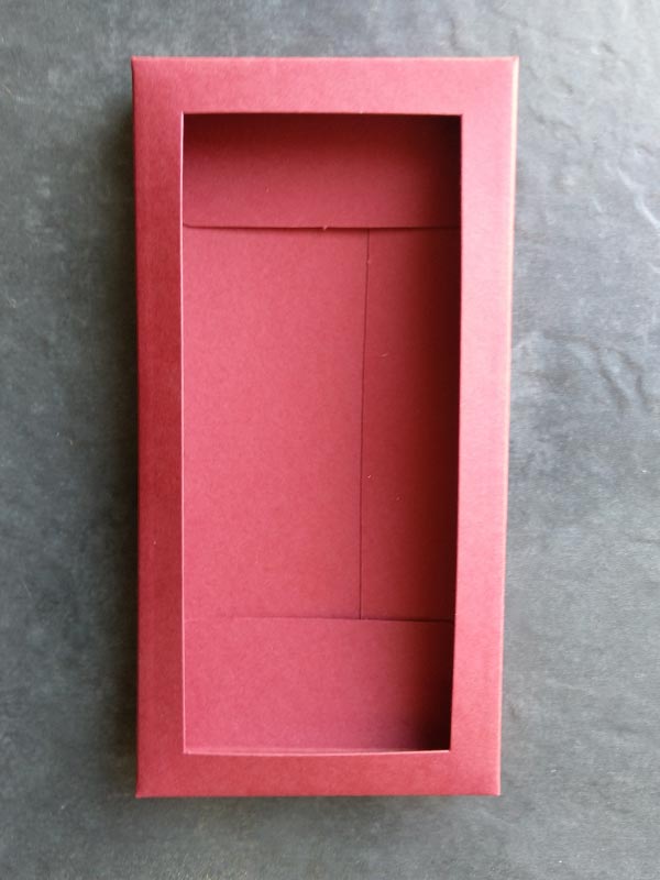 Folding box for chocolate bars in dark red