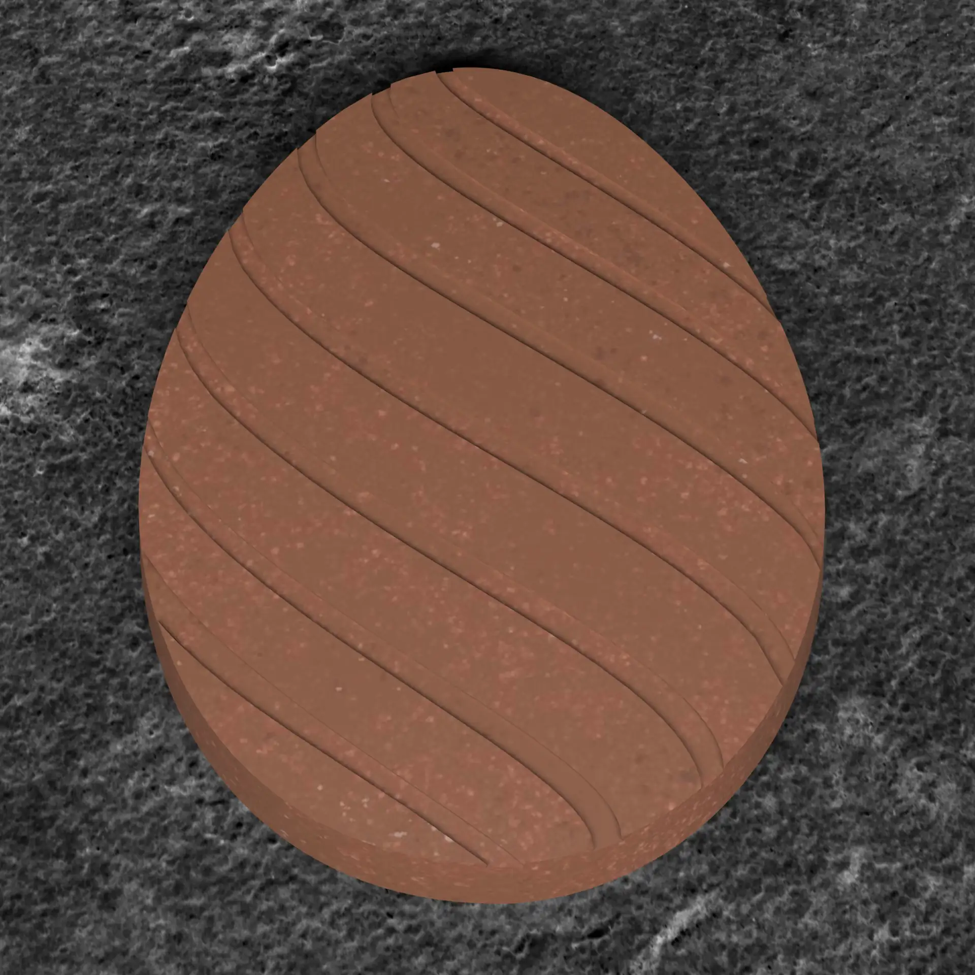 A chocolate tablet shaped like an egg with lines on it