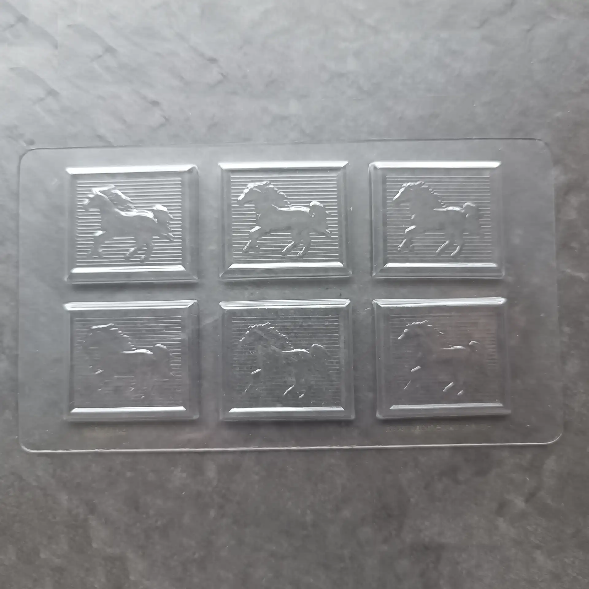 Mould for small chocolate tablets with a horse