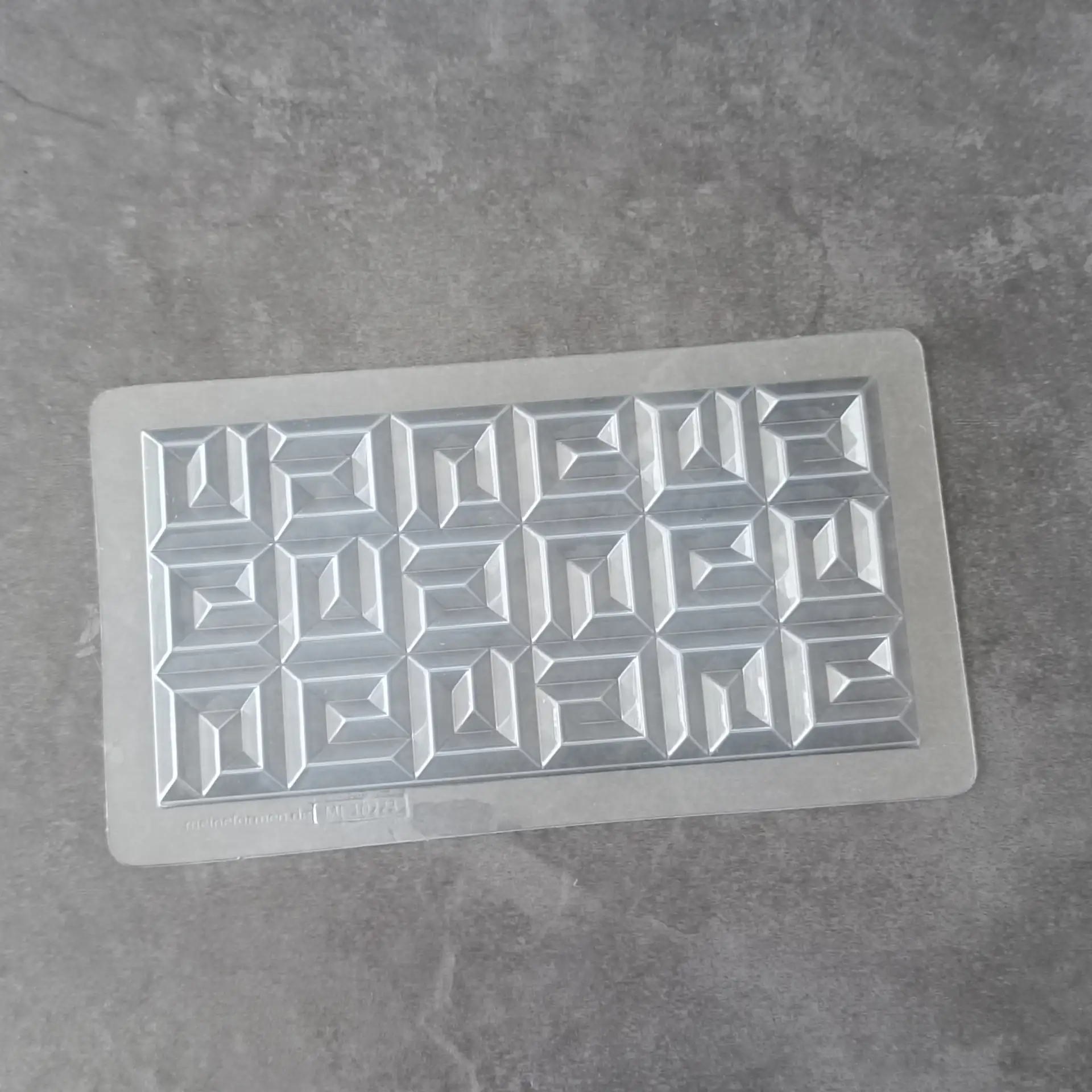 Mould for chocolate bars with an intricate mosaic pattern